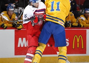 MONTREAL, CANADA - DECEMBER 31: The Czech Republic's Daniel Kurovsky #16 takes a hit from Sweden's Filip Ahl #11 during preliminary round action at the 2017 IIHF World Junior Championship. (Photo by Francois Laplante/HHOF-IIHF Images)

